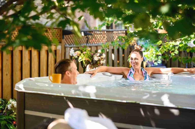 man and women relaxing in hot tub