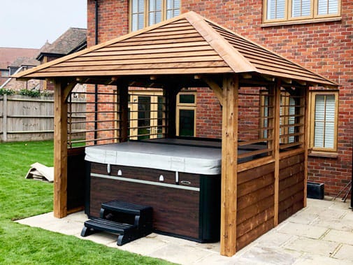Hot tub cover with barnclad hipped roof