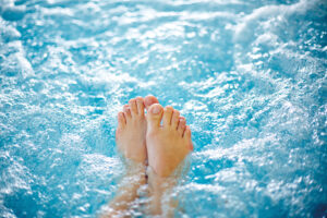 feet floating in hot tub